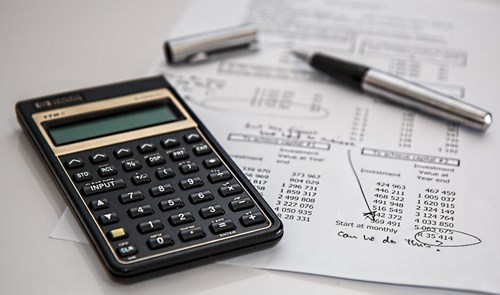 Calculator with financial document 