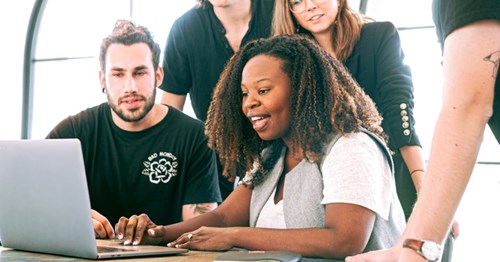 Group of people working on a computer 