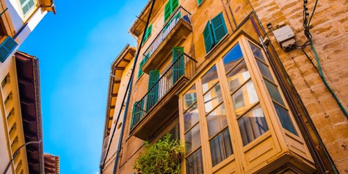 View of apartment building from ground level - looking up. 